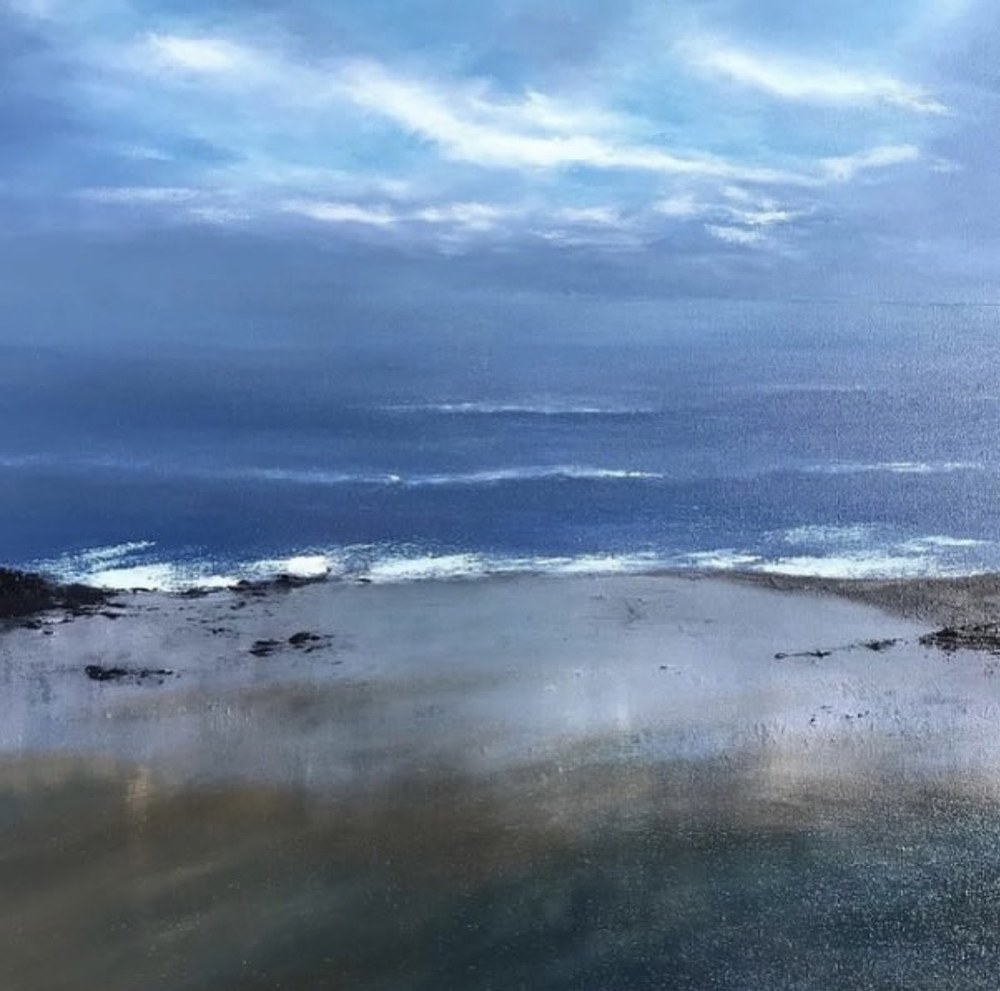 Painting of a moody blue sea and sky above a wet, light-reflecting beach